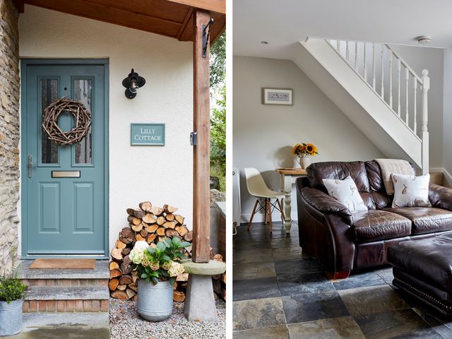 A blue front door with a wreath and stacked firewood outside next to a potted plant and a stone bench at Lilly Cottage in Whitecroft Royal Forest of Dean