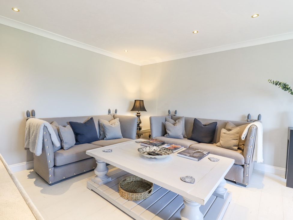 A living room with two grey sofas and a white coffee table at Closefield in Ivinghoe Aston near Ivinghoe