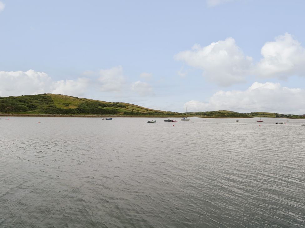 A body of water with several small boats and hills in the background at Tom's Cottage in Rosmoney near Westport County Mayo