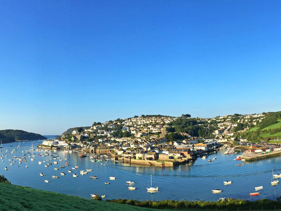 A coastal town with houses on hills and boats in the water at Villa 8 Estura Salcombe